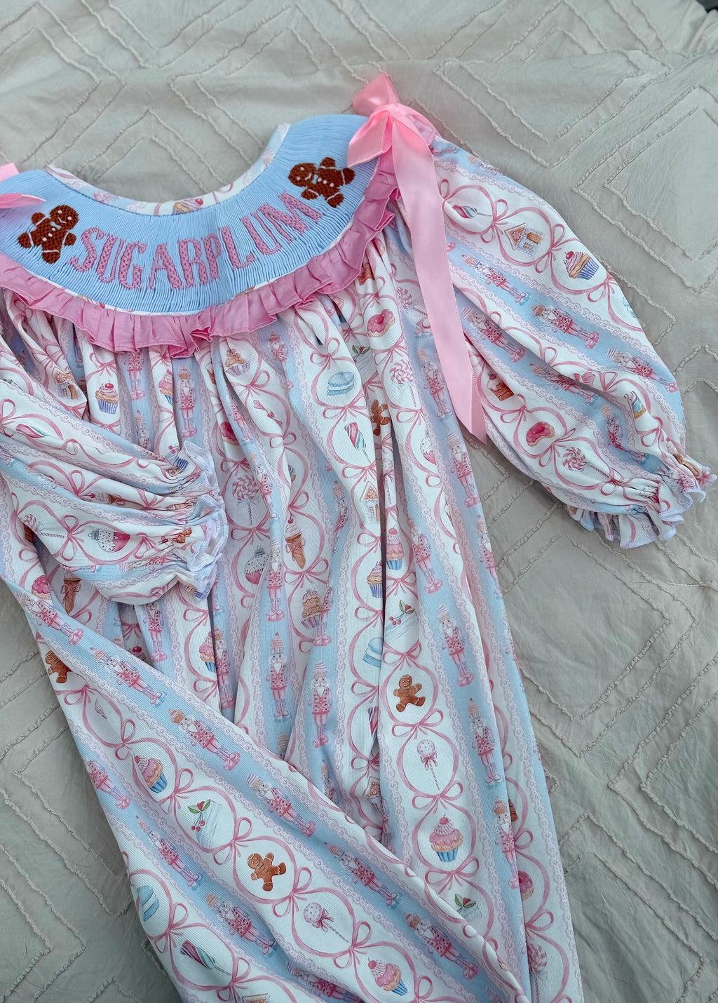 Girls Christmas romper with pink satin bows and ruffled neckline